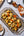 Roasted potatoes and olives served with Sunnybank pineapple and habanero hot sauce.