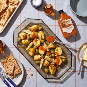 Roasted potatoes and olives served with Sunnybank pineapple and habanero hot sauce.